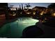 Inviting outdoor pool and spa area with landscape lighting at dusk at 10342 E Obispo Ave, Mesa, AZ 85212