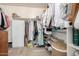 Organized walk-in closet with shelves and hanging rods for ample storage at 10342 E Obispo Ave, Mesa, AZ 85212
