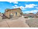 Home's backyard with a lovely private pool, patio, rock landscaping and block fence at 1147 E Harvest Rd, San Tan Valley, AZ 85140