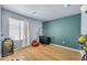 Spacious bedroom with hardwood floors, natural light, with an accent wall, and modern design at 1147 E Harvest Rd, San Tan Valley, AZ 85140