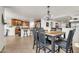 Open floor plan with dining area that flows into the kitchen and living areas at 1147 E Harvest Rd, San Tan Valley, AZ 85140