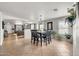 Open concept with dining area next to Gathering room and hard surface flooring at 1147 E Harvest Rd, San Tan Valley, AZ 85140