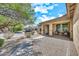 Exterior view of a home with desert landscaping, a sidewalk and a charming porch area at 1147 E Harvest Rd, San Tan Valley, AZ 85140