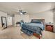 Large main bedroom with carpeted floors, a ceiling fan, and lots of natural light at 1147 E Harvest Rd, San Tan Valley, AZ 85140