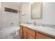 Bathroom with marble countertops and light-colored tile at 13020 W Highland Ave, Litchfield Park, AZ 85340