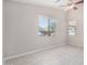 Spacious bedroom with wood-look floors and a window overlooking the yard at 13020 W Highland Ave, Litchfield Park, AZ 85340