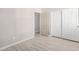 Bedroom with a closet and wood-look floors at 13020 W Highland Ave, Litchfield Park, AZ 85340