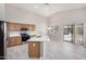 Kitchen with island, stainless appliances, quartz countertops, and wood cabinets at 13020 W Highland Ave, Litchfield Park, AZ 85340