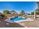 Sparkling blue pool featuring a spa and water feature in the backyard at 13020 W Highland Ave, Litchfield Park, AZ 85340