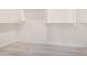Large walk-in closet with wood-look floors and ample white shelving at 13020 W Highland Ave, Litchfield Park, AZ 85340