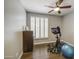 Bedroom with a ceiling fan and gym equipment at 14039 S 33Rd Way, Phoenix, AZ 85044