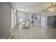 Open-concept dining area with hardwood floors and views of the living area and a bright dining room at 14039 S 33Rd Way, Phoenix, AZ 85044