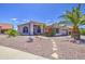 Charming single-story home featuring desert landscaping and a well-manicured yard with mature trees at 14039 S 33Rd Way, Phoenix, AZ 85044