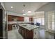 Spacious kitchen featuring an island with countertop, stainless steel appliances, and natural light at 14039 S 33Rd Way, Phoenix, AZ 85044