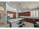 Open kitchen featuring counter seating, stainless steel appliances, ample cabinet space, and an adjacent dining table at 14039 S 33Rd Way, Phoenix, AZ 85044