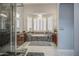 Luxurious main bathroom with soaking tub, a shower and bay windows at 14039 S 33Rd Way, Phoenix, AZ 85044