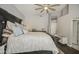 Spacious main bedroom with a ceiling fan, large bed, and plenty of natural light at 14039 S 33Rd Way, Phoenix, AZ 85044