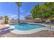 Sparkling backyard pool with a bright blue sky and well maintained yard at 14039 S 33Rd Way, Phoenix, AZ 85044