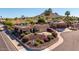 Wide aerial view of a home with desert landscaping, a two-car garage, and mountain scenery at 15630 N 20Th St, Phoenix, AZ 85022