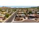 Wide aerial perspective captures the home's proximity to major streets and nearby houses at 15630 N 20Th St, Phoenix, AZ 85022