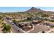 Aerial view of home with desert landscaping and lush trees within the neighborhood at 15630 N 20Th St, Phoenix, AZ 85022