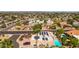 High-angle shows solar panels and a private pool nestled amidst a peaceful neighborhood at 15630 N 20Th St, Phoenix, AZ 85022