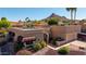 Overhead view of a home with a tile roof, well-manicured yard, and mountain views in the background at 15630 N 20Th St, Phoenix, AZ 85022