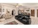 Open-concept living room flowing to the kitchen, showcasing comfortable seating and modern appliances at 15630 N 20Th St, Phoenix, AZ 85022