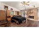 Main bedroom features built-in cabinets, a fireplace, and a sliding glass door at 15630 N 20Th St, Phoenix, AZ 85022