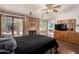 Large bedroom with a fireplace and a sliding glass door leading to the backyard at 15630 N 20Th St, Phoenix, AZ 85022