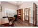 Office with hardwood flooring, a wooden desk, and natural light from window at 15630 N 20Th St, Phoenix, AZ 85022