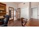 Office space with hardwood flooring, desk, and shelving, great for working or studying at 15630 N 20Th St, Phoenix, AZ 85022