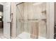 Modern walk-in shower with glass door and sleek hardware, offering a spa-like experience at 15630 N 20Th St, Phoenix, AZ 85022