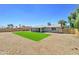 An expansive backyard with a pristine artificial turf area, perfect for outdoor activities at 1716 W Villa Theresa Dr, Phoenix, AZ 85023
