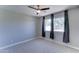 Bedroom featuring neutral walls and carpet, complemented by a ceiling fan and natural light from the window at 1716 W Villa Theresa Dr, Phoenix, AZ 85023