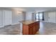 Open-concept kitchen with spacious island featuring ample storage space and granite countertops at 1716 W Villa Theresa Dr, Phoenix, AZ 85023