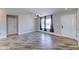 Bright living room features wood-look tile flooring and neutral paint, perfect for relaxing at 1716 W Villa Theresa Dr, Phoenix, AZ 85023