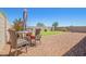Charming backyard patio with comfortable seating, perfect for outdoor dining and relaxation at 17352 W Red Fox Rd, Surprise, AZ 85387