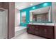 Bright bathroom features dual sinks, undermount tub, a stand-alone shower and a large window at 17352 W Red Fox Rd, Surprise, AZ 85387