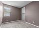 Bedroom featuring neutral carpet, closet, and modern paint at 17352 W Red Fox Rd, Surprise, AZ 85387