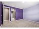 Bedroom boasts neutral carpet, recessed lighting, a closet, ensuite access, and calming, neutral walls at 17352 W Red Fox Rd, Surprise, AZ 85387