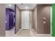 A modern foyer featuring neutral walls and a bright white front door at 17352 W Red Fox Rd, Surprise, AZ 85387
