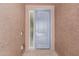 Close up of a welcoming blue front door with sidelight at 17352 W Red Fox Rd, Surprise, AZ 85387