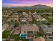 An aerial perspective captures a private oasis featuring a sparkling pool, luxurious spa, and outdoor entertainment area at 17850 E Bronco Ct, Queen Creek, AZ 85142