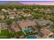 Experience outdoor living with an aerial view of this home featuring a sparkling pool, spa, and well-manicured yard at 17850 E Bronco Ct, Queen Creek, AZ 85142