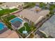 Picture perfect backyard with pool, spa and outdoor kitchen/bar area ready for entertaining and relaxation at 17850 E Bronco Ct, Queen Creek, AZ 85142