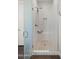 Elegant bathroom with a tiled walk-in shower and a glass door at 17850 E Bronco Ct, Queen Creek, AZ 85142