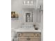 Bright bathroom with white vanity, neutral cabinets, and modern fixtures at 17850 E Bronco Ct, Queen Creek, AZ 85142