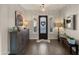 Inviting entryway featuring a decorative door, stylish furnishings, and light-filled sidelights at 17850 E Bronco Ct, Queen Creek, AZ 85142