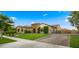 Well-maintained home with a three-car garage, neat landscaping, and a stone-accented facade at 17850 E Bronco Ct, Queen Creek, AZ 85142